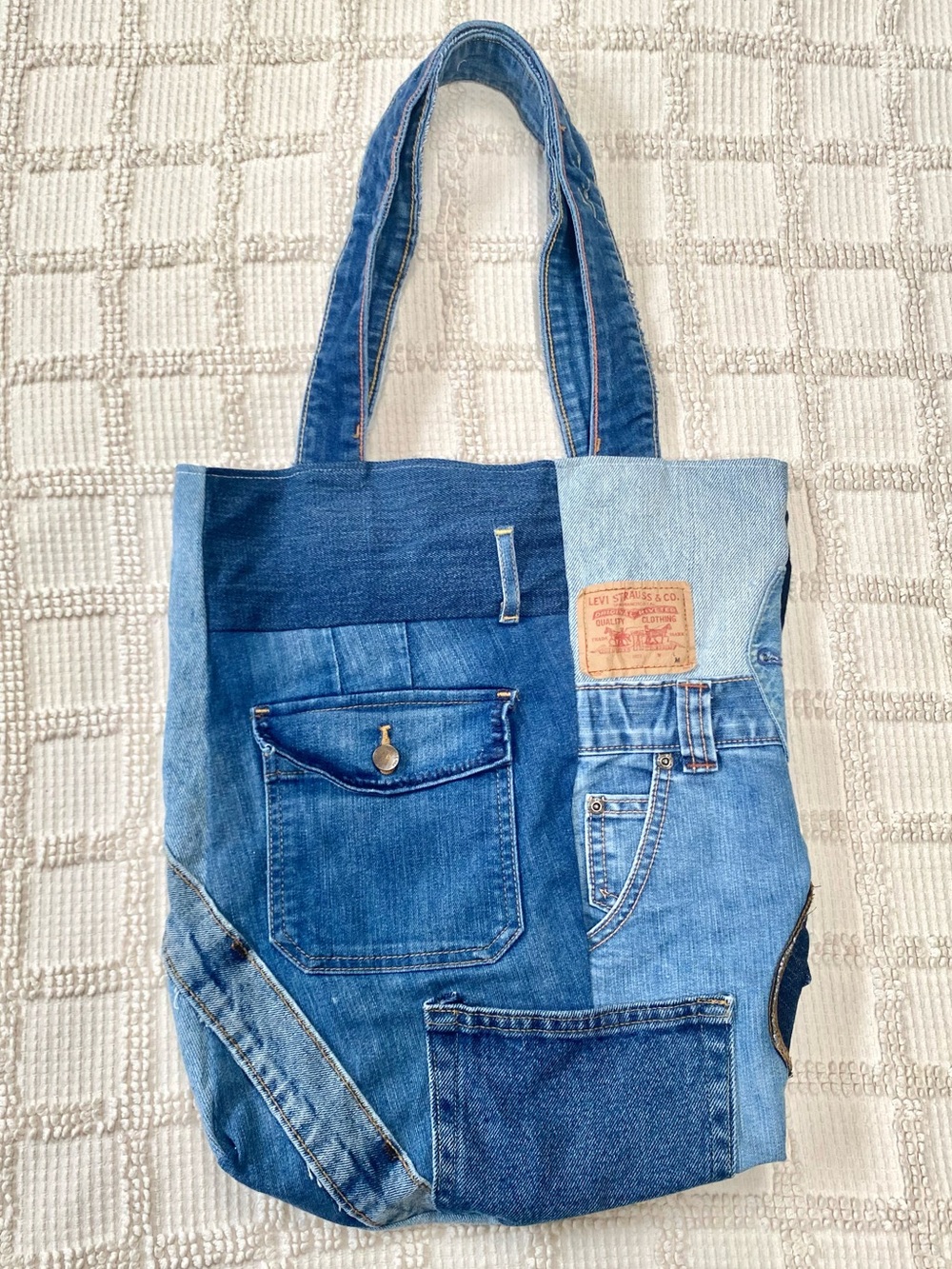 Handmade reworked jeans patchwork tote bag with recycled denim pockets